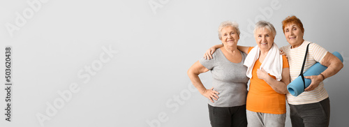 Elderly women holding yoga ...