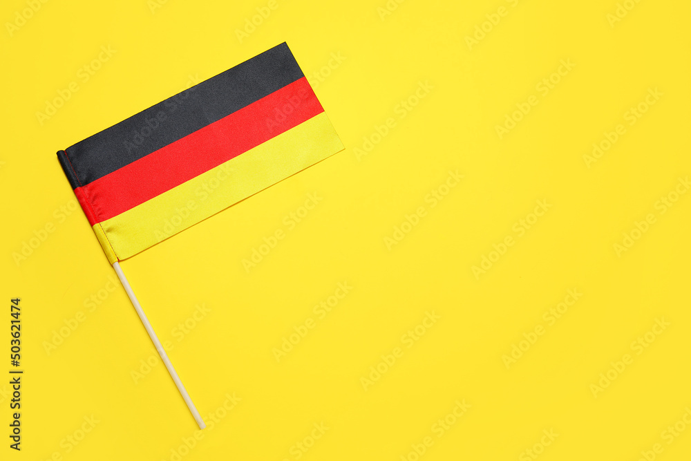 National flag of Germany on yellow background National flag of Germany on yellow background