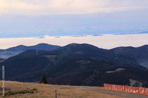 Blick vom Berg Belchen auf die Wolken behangenen Täler des Schwarzwalds	 photo