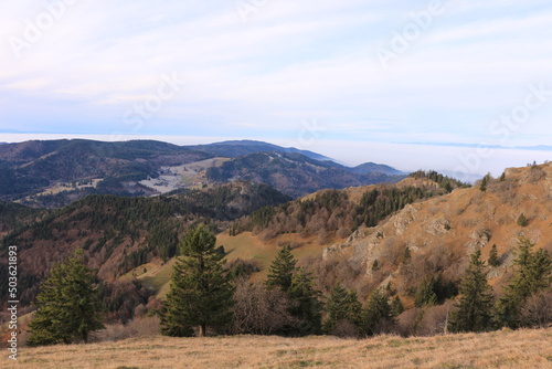 Blick vom Berg Belchen auf die Wolken behangenen Täler des Schwarzwalds	 photo