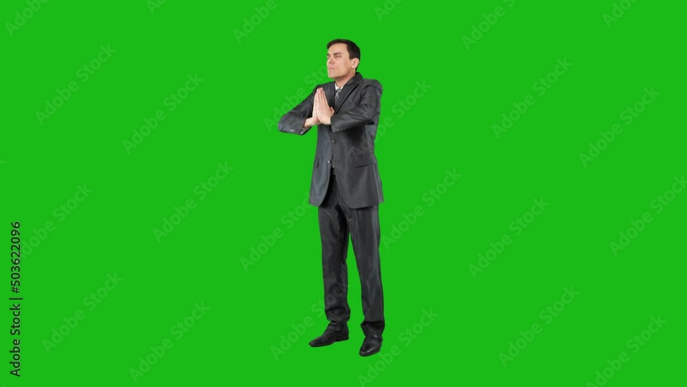 Calm businessman meditating on chroma key, full body Calm businessman meditating on chroma key, full body