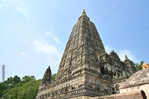 Low angle shot of the tall Mahabodhi Mahavihar Temple - Place of enlightenment  Buddha photo