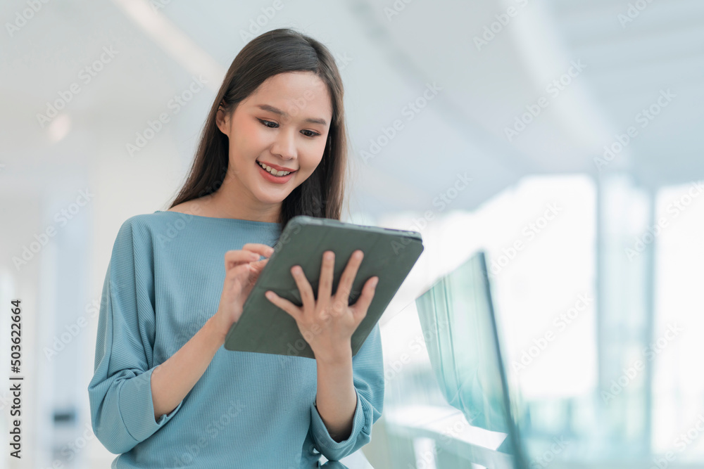 digital nomad lifestyle asian female woman hand using tablet working white stay outside with natural light,asian female young woman smiling cheerful freedom positive smile standing hand hold tablet digital nomad lifestyle asian female woman hand using tablet working white stay outside with natural light,asian female young woman smiling cheerful freedom positive smile standing hand hold tablet