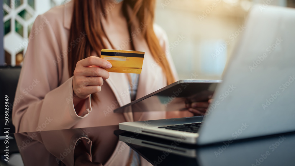 Business woman hands using smartphone and holding credit card sitting. Online Shopping concept... Business woman hands using smartphone and holding credit card sitting. Online Shopping concept...