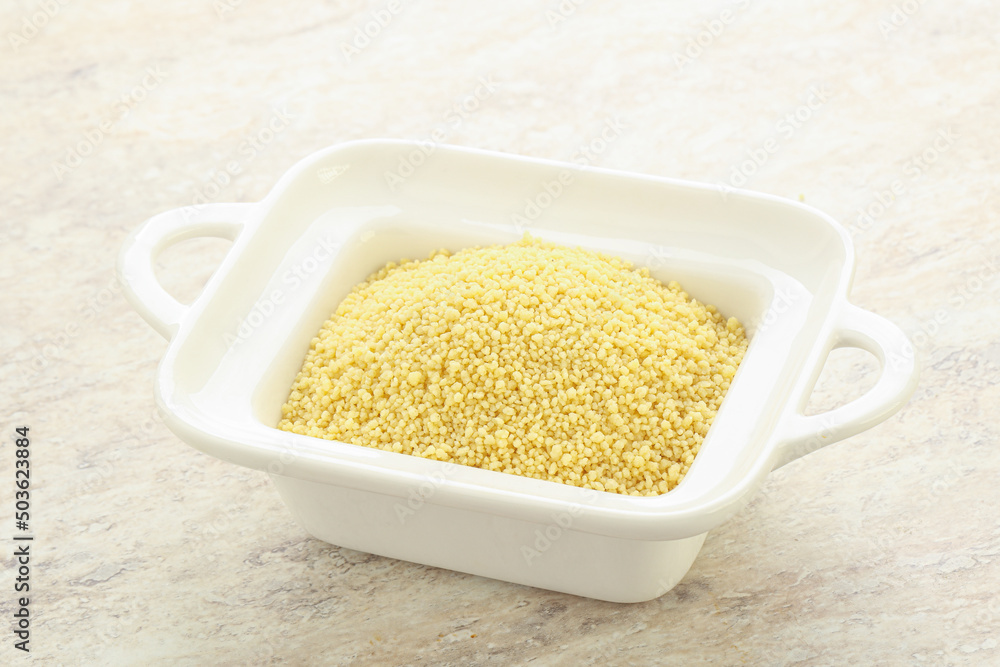 Raw couscous in the bowl