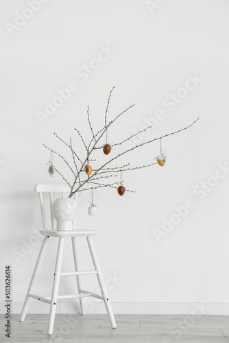 Vase with tree branches and...
