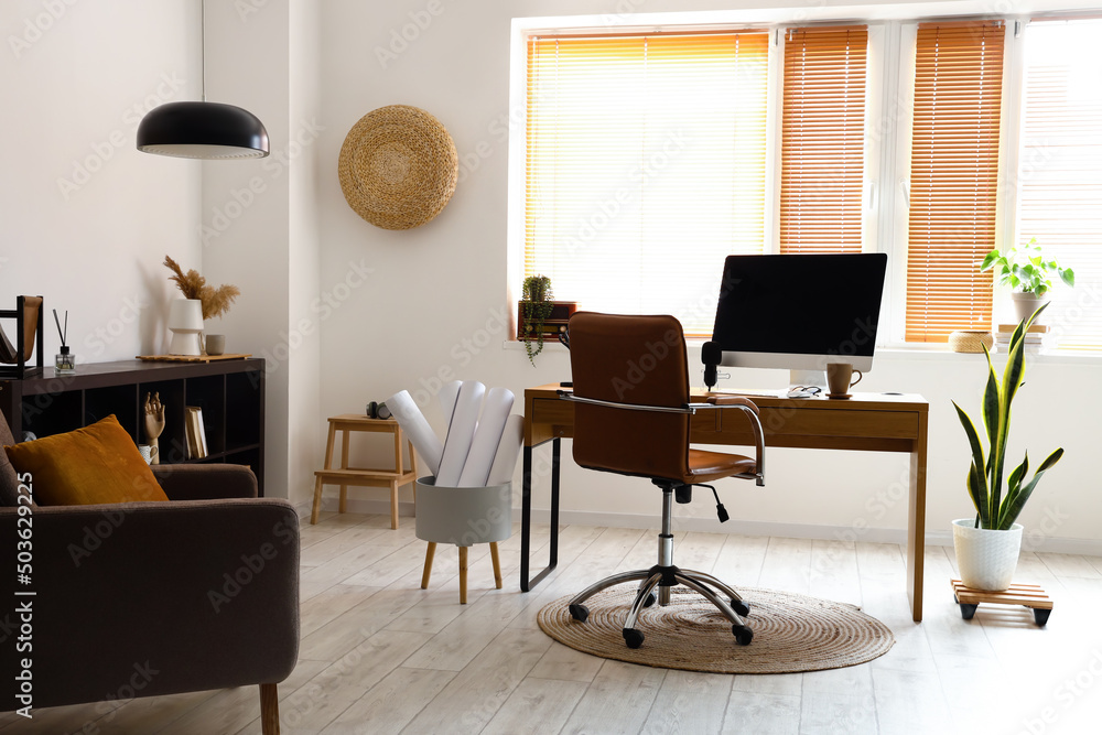 Stylish interior of light room with modern workplace Stylish interior of light room with modern workplace