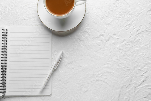 Notebook, cup of coffee and...