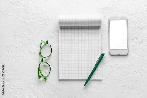 Notebook, phone, glasses an...