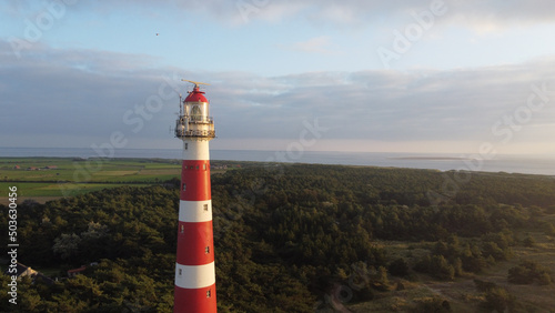 Beautiful view of the Bornrif Lighthouse in the countryside of Ameland, the Netherlands photo