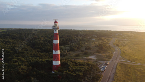 Aerial view of the Bornrif Lighthouse in the countryside of Ameland, the Netherlands at sunset photo