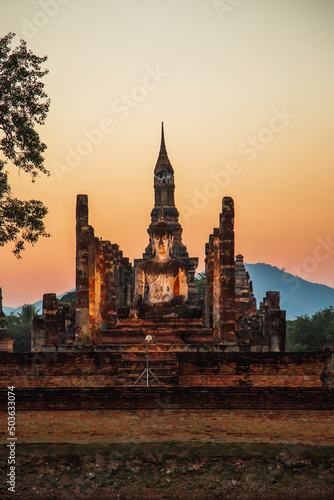 Sunset at Wat Mahathat buddha and temple in Sukhothai Historical Park © pierrick