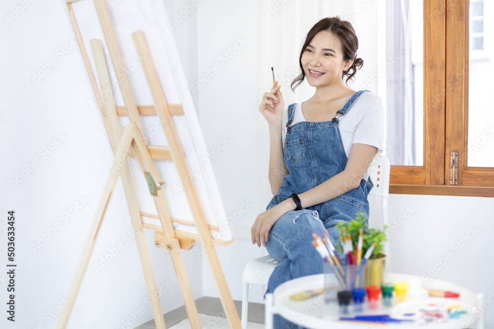 Female artist painting on canvas, Artist studio interior, Draw with watercolor, Drawing supplies , Painting and creativity, Use a brush to draw a pattern by stripes, Artwork, Using Paint Brush. Female artist painting on canvas, Artist studio interior, Draw with watercolor, Drawing supplies , Painting and creativity, Use a brush to draw a pattern by stripes, Artwork, Using Paint Brush.