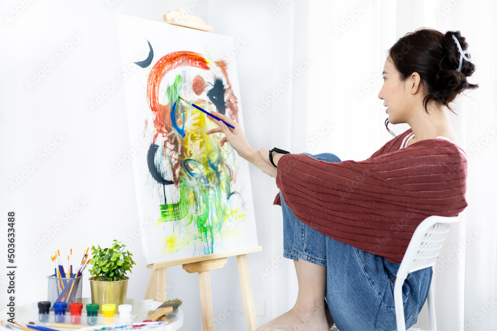 Female artist painting on canvas, Artist studio interior, Draw with watercolor, Drawing supplies , Painting and creativity, Use a brush to draw a pattern by stripes, Artwork, Using Paint Brush. Female artist painting on canvas, Artist studio interior, Draw with watercolor, Drawing supplies , Painting and creativity, Use a brush to draw a pattern by stripes, Artwork, Using Paint Brush.