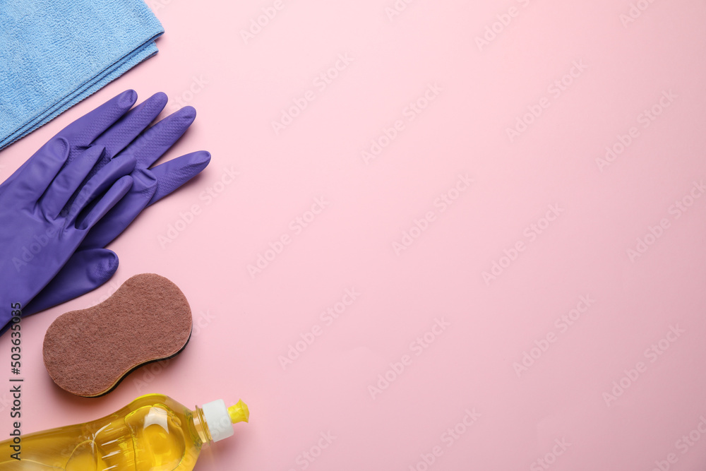 Flat lay composition with sponge and other cleaning supplies on pink background. Space for text Flat lay composition with sponge and other cleaning supplies on pink background. Space for text