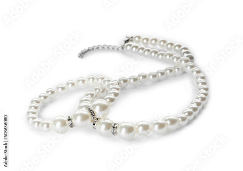 Elegant pearl necklace and bracelet on white background