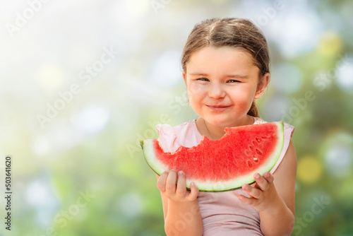 Happy child girl with watermelon bite isolated