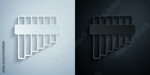 Paper cut Pan flute icon isolated on grey and black background. Traditional peruvian musical instrument. Folk instrument from Peru, Bolivia and Mexico. Paper art style. Vector