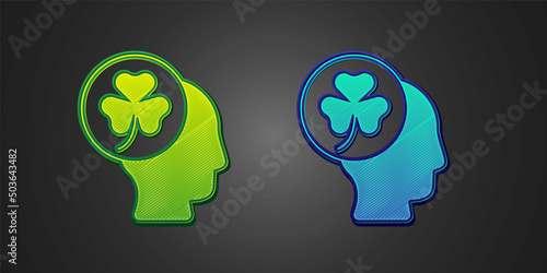 Green and blue Human head with clover trefoil leaf icon isolated on black background. Happy Saint Patricks day. National Irish holiday. Vector