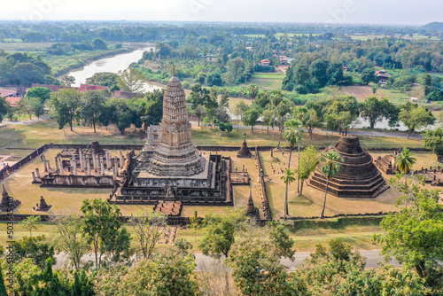 Aerial view of Wat Phra Sri Rattana Mahathat Rajaworaviharn temple and buddha in Si Satchanalai historical park, Thailand photo