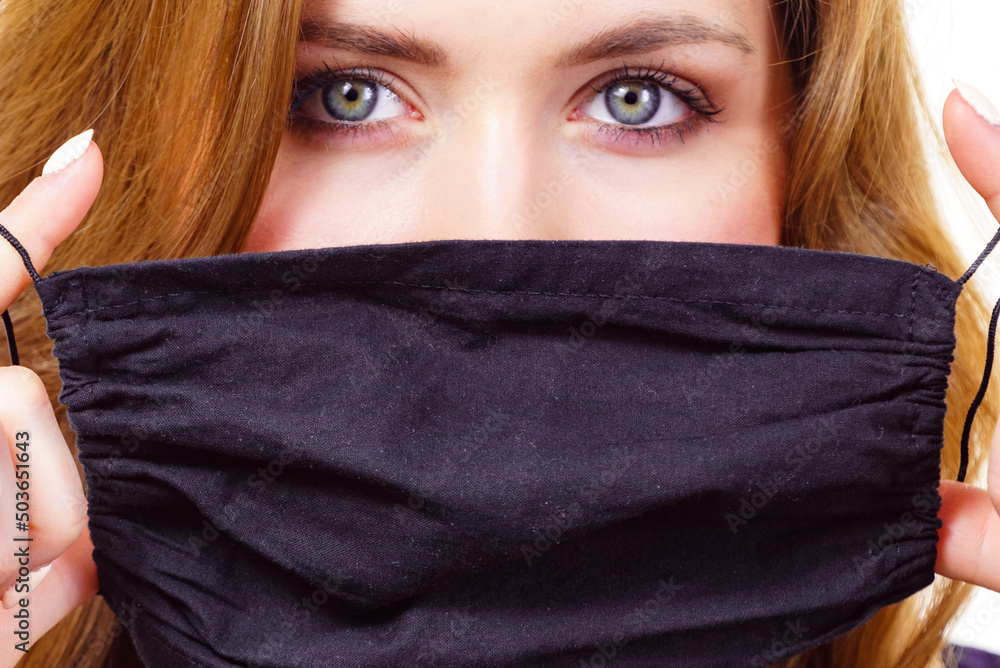 Woman using protective face mask. Woman using protective face mask.