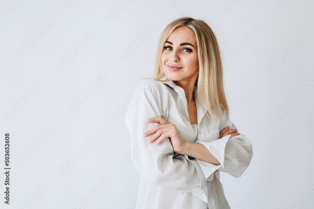 Eyelash extension master in a white shirt on a white background. Eyelash extension master in a white shirt on a white background.