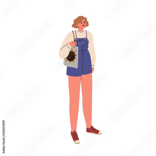Woman wearing fashion clothes, short jeans jumpsuit and sneakers. Modern stylish girl in casual summer outfit, tote bag. Female in trendy apparel. Flat vector illustration isolated on white background