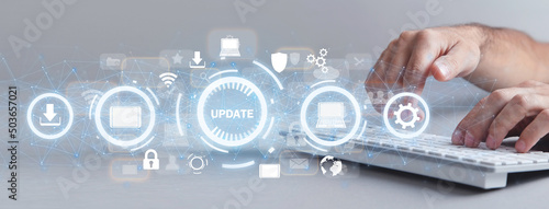 Obraz w ramie Hands typing in computer keyboard. Installing software update process