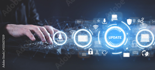 Hands typing in computer keyboard. Installing software update process