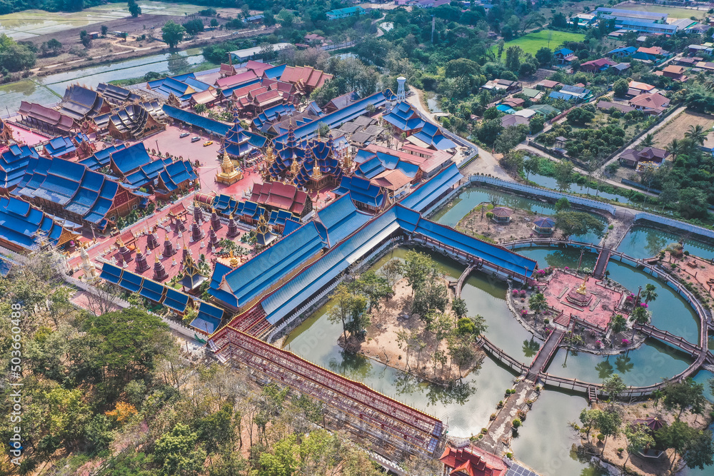 Aerial view of Wat Phiphat Mongkhon blue temple in Sukhothai, Thailand