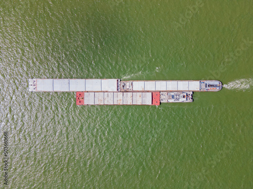Top down aerial view of cargo ship on the river Danube