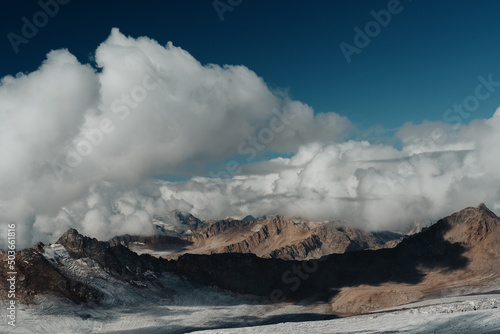 Landscape. Mountains in the clouds at high altitude. Film processing.