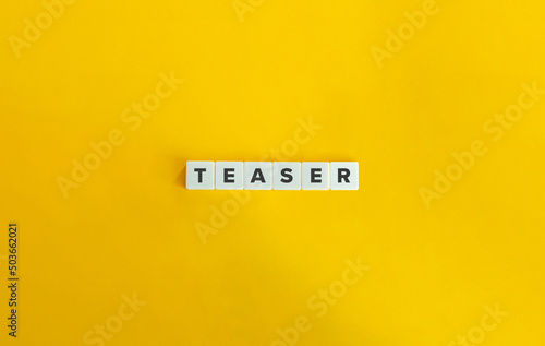 Teaser Word on Letter Tiles on Yellow Background. Minimal Aesthetics.