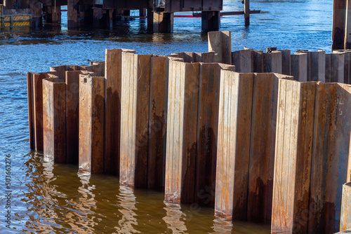 Larsen sheet piling in the river photo