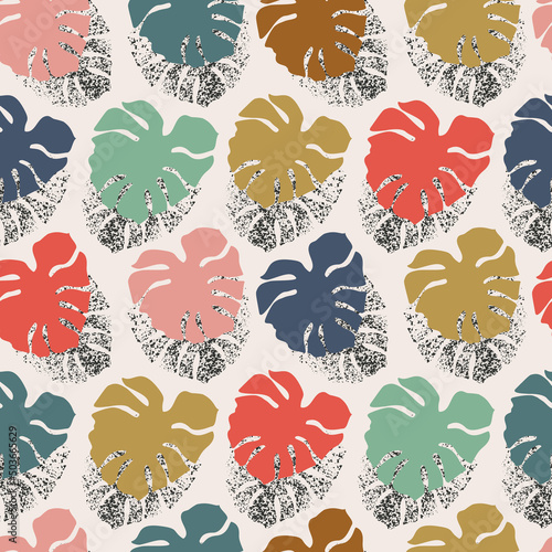 Tropical seamless pattern with grunge monstera leaves silhouette