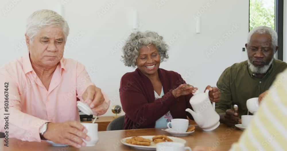Happy senior diverse people drinking tea at retirement home Happy senior diverse people drinking tea at retirement home