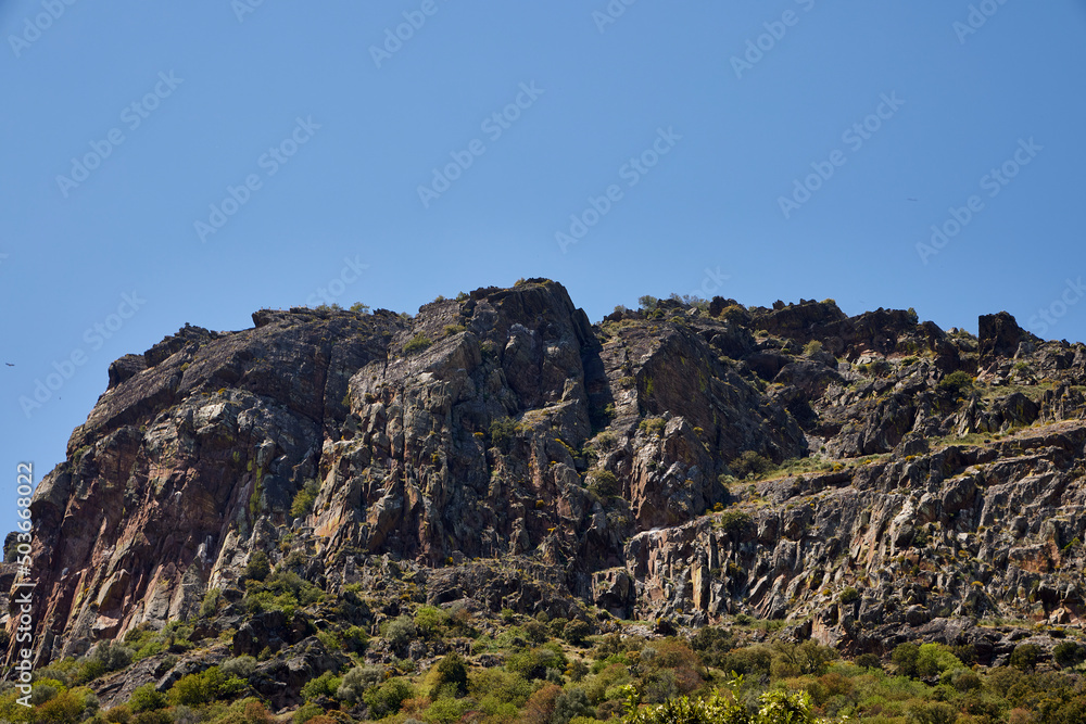 Mountain. High rise rock formation with a cloudless sky