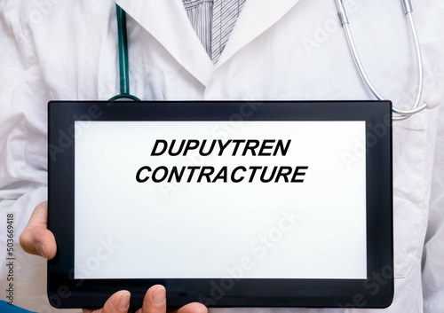 Dupuytren Contracture.  Doctor with rare or orphan disease text on tablet screen Dupuytren Contracture photo