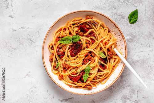 Pasta with bolognese sauce and sun-dried tomatoes photo