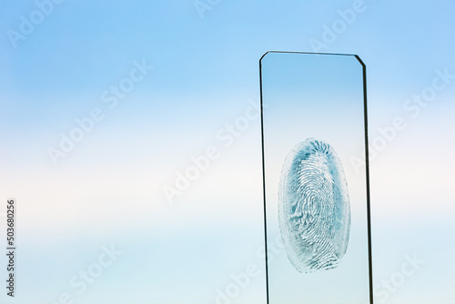 Close-up of blue color fingerprint texture of finger skin photo