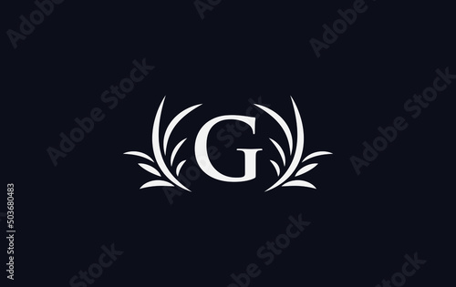 Golden laurel wreath leaf logo vector with the letters and alphabets G