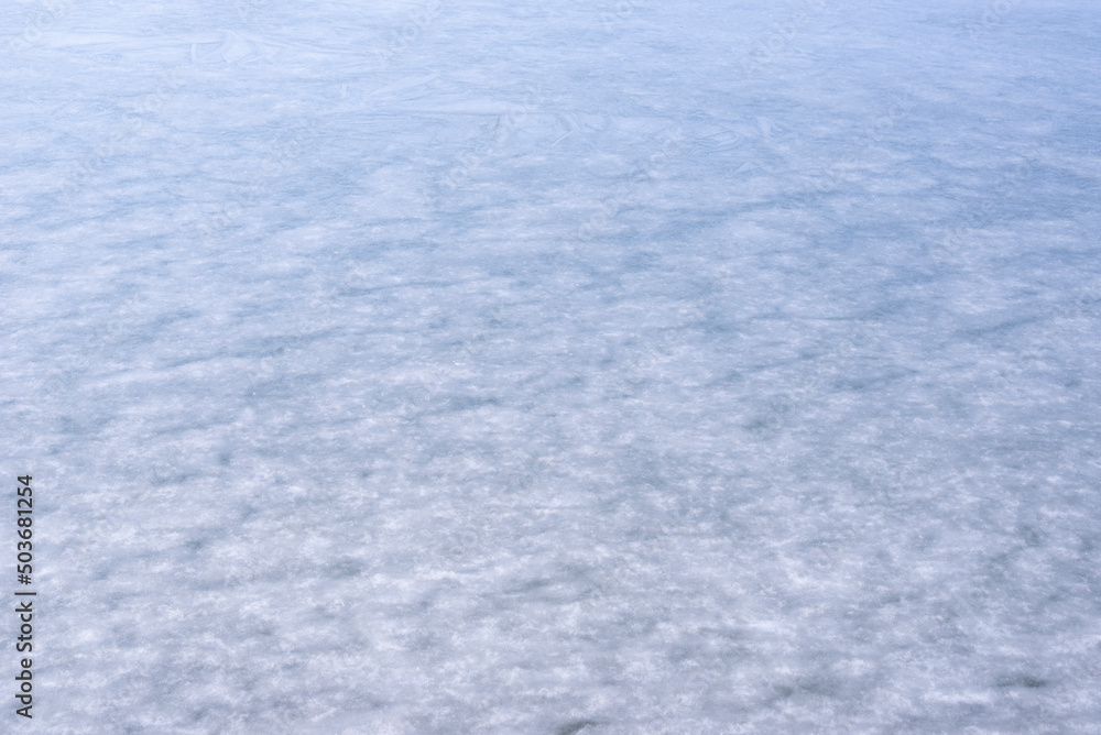 Natural texture of ice, frozen lake  as  background.