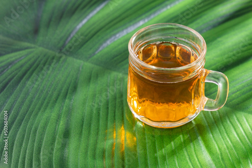 Fresh homemade Aguapanela, Agua de Panela or Aguadulce, a popular Latin American sweet drink made of panela unrefined whole cane sugar boiled in water photo