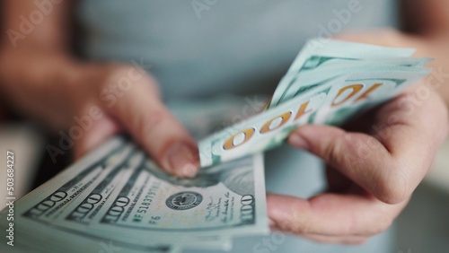 dollar money. bankrupt man counting money cash. business crisis finance dollar lifestyle concept. close-up of a hand counting paper dollars. exchange finance economy dollar usd photo