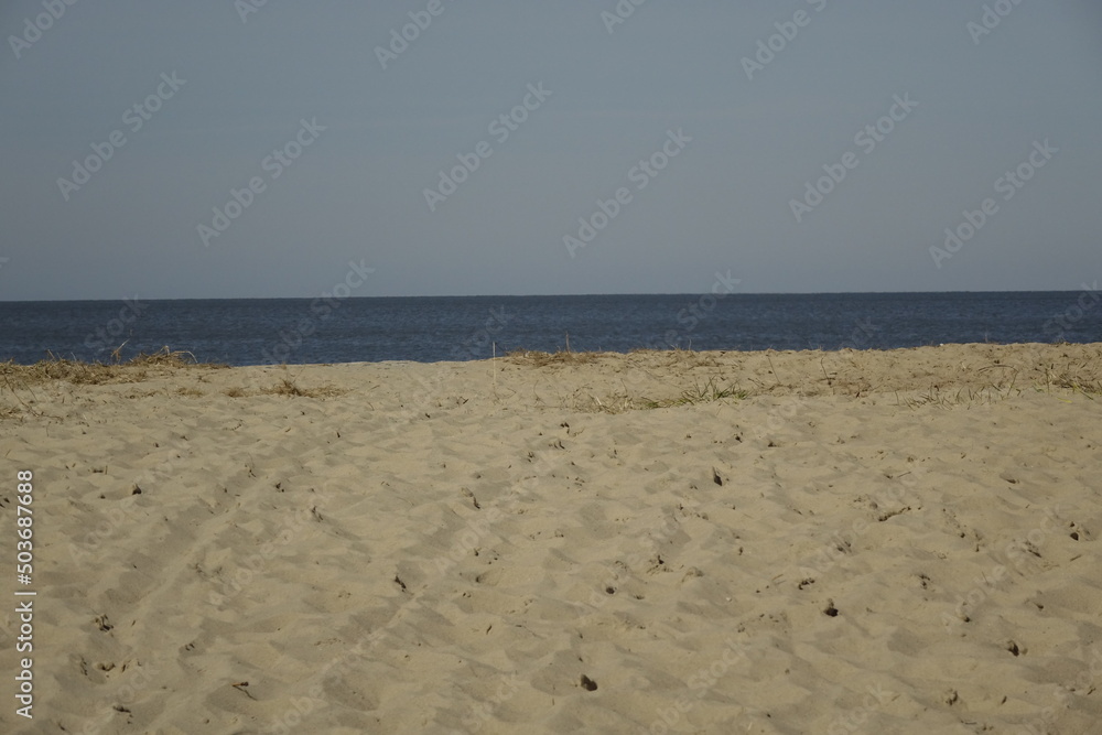North Sea beach with soft sand at high tide, sunny spring day (horizontal), Sahlenburg, Lower Saxony, Germany