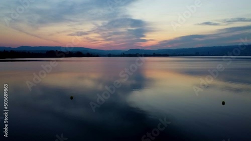 Sun rise by the lake flying over the diving platform photo