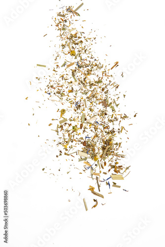 Scattered herbal tea with cammomile on a white isolated background