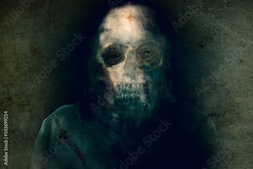 A horror concept of a demonic figure screaming with black sunken skull eyes. On a dark grunge background.