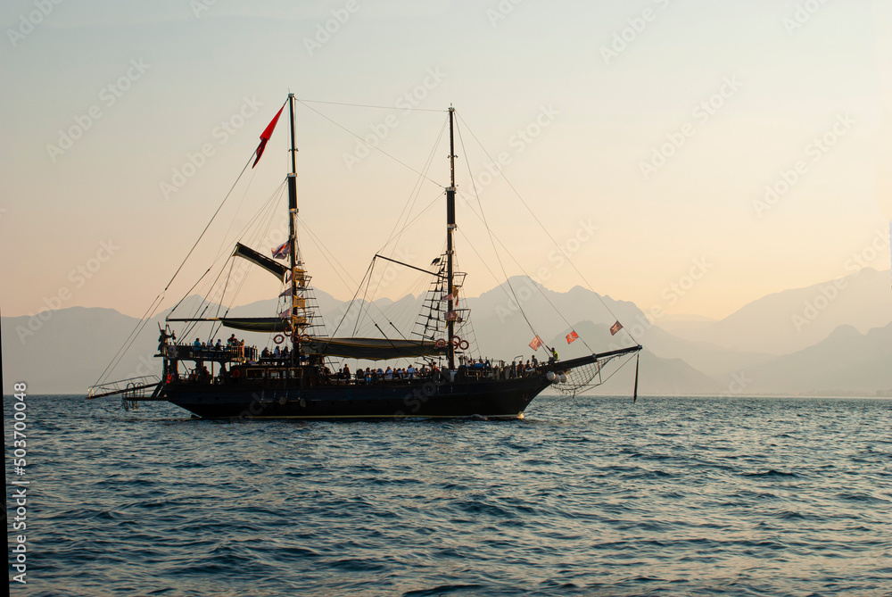 tourist sailing ship at sea at dawn tourist sailing ship at sea at dawn