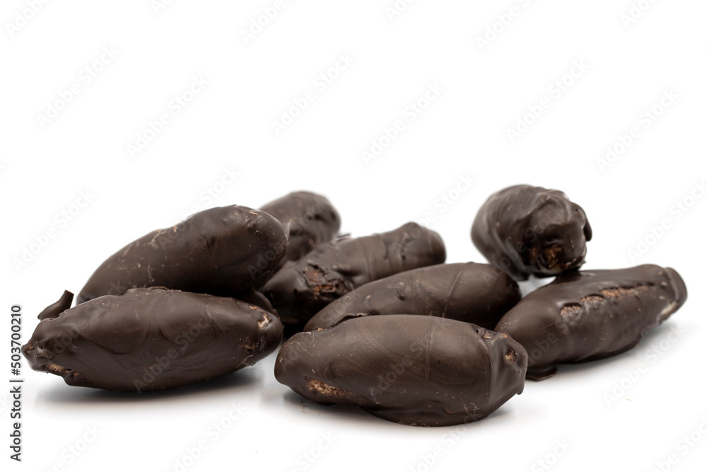 Special chocolate with dark outside and coconut inside. Dark chocolate with coconut filling on a white background. close up Special chocolate with dark outside and coconut inside. Dark chocolate with coconut filling on a white background. close up